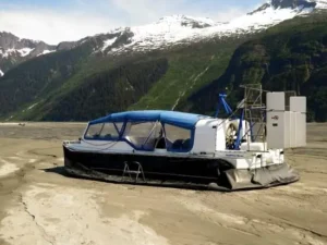 Allen Marine Explorer 22 on tidal flats below mountains
