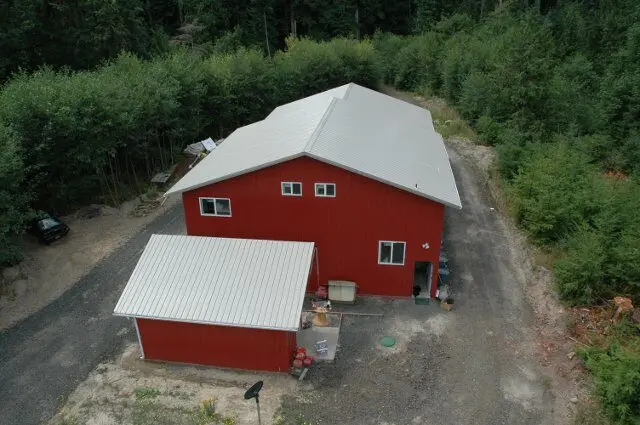 Aerial view of the red Amphibious Marine hovercraft shop surrounded by trees