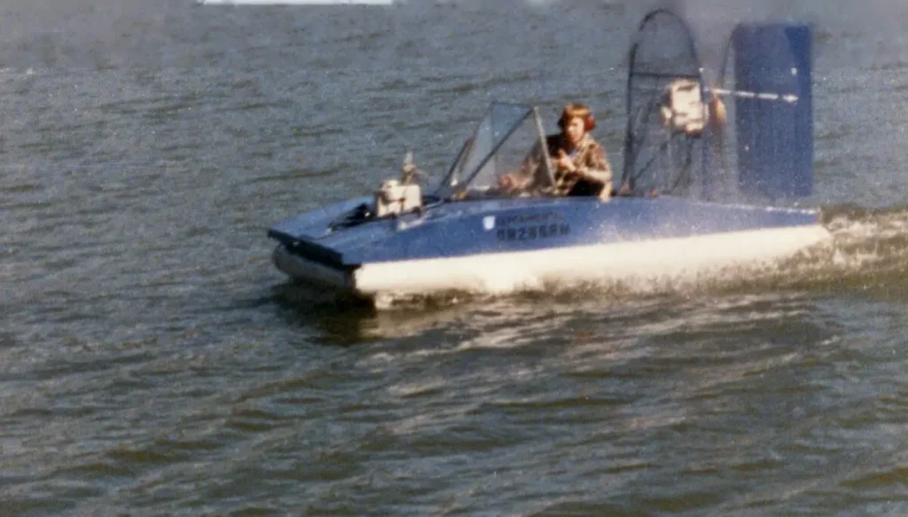 The blue UH-10T hovercraft running on open water, March 1989