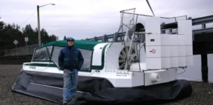 Bryan Phillips beside an Explorer 22 TDi