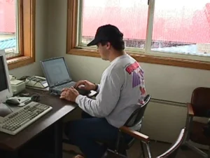 John Carter updating the 1998 trip blog from a laptop by dial up modem