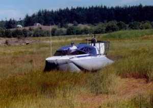 The Explorer 20 hovercraft on the grass flats of the Skagit River delta