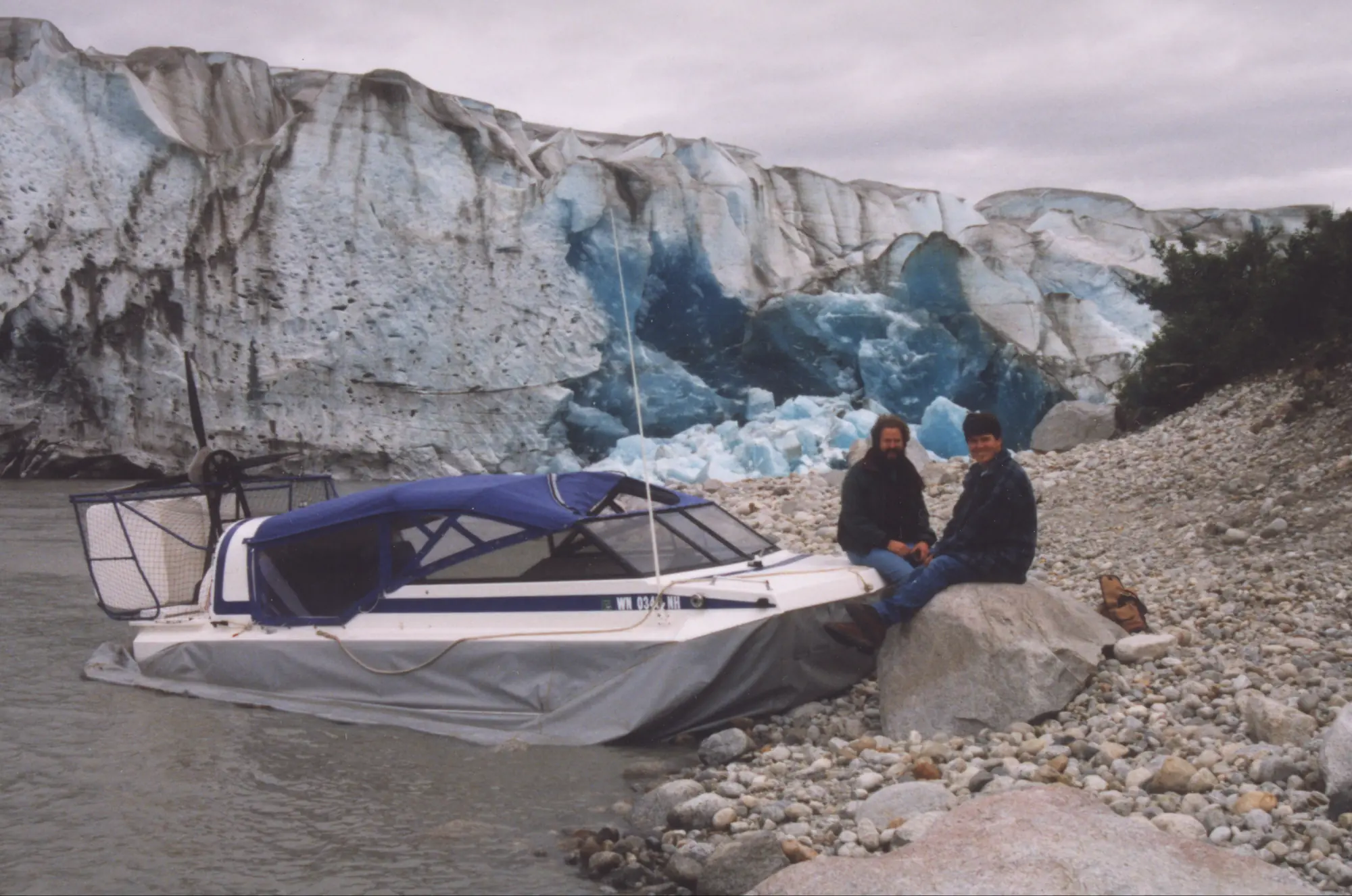 The Explorer 20 hovercraft parked on the rocks below the ice face of the Taku Glacier, 1998