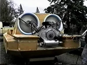 The 1.4 liter Subaru engine and belt drive mounted ahead of the twin fans on the Explorer 20 prototype, March 1996