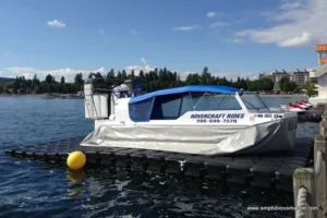 Explorer 22 TDi at a floating dock with a hovercraft rides sign