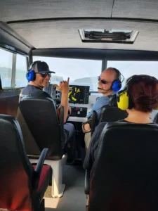 Pilot and passengers in headsets in the Explorer 24 cockpit