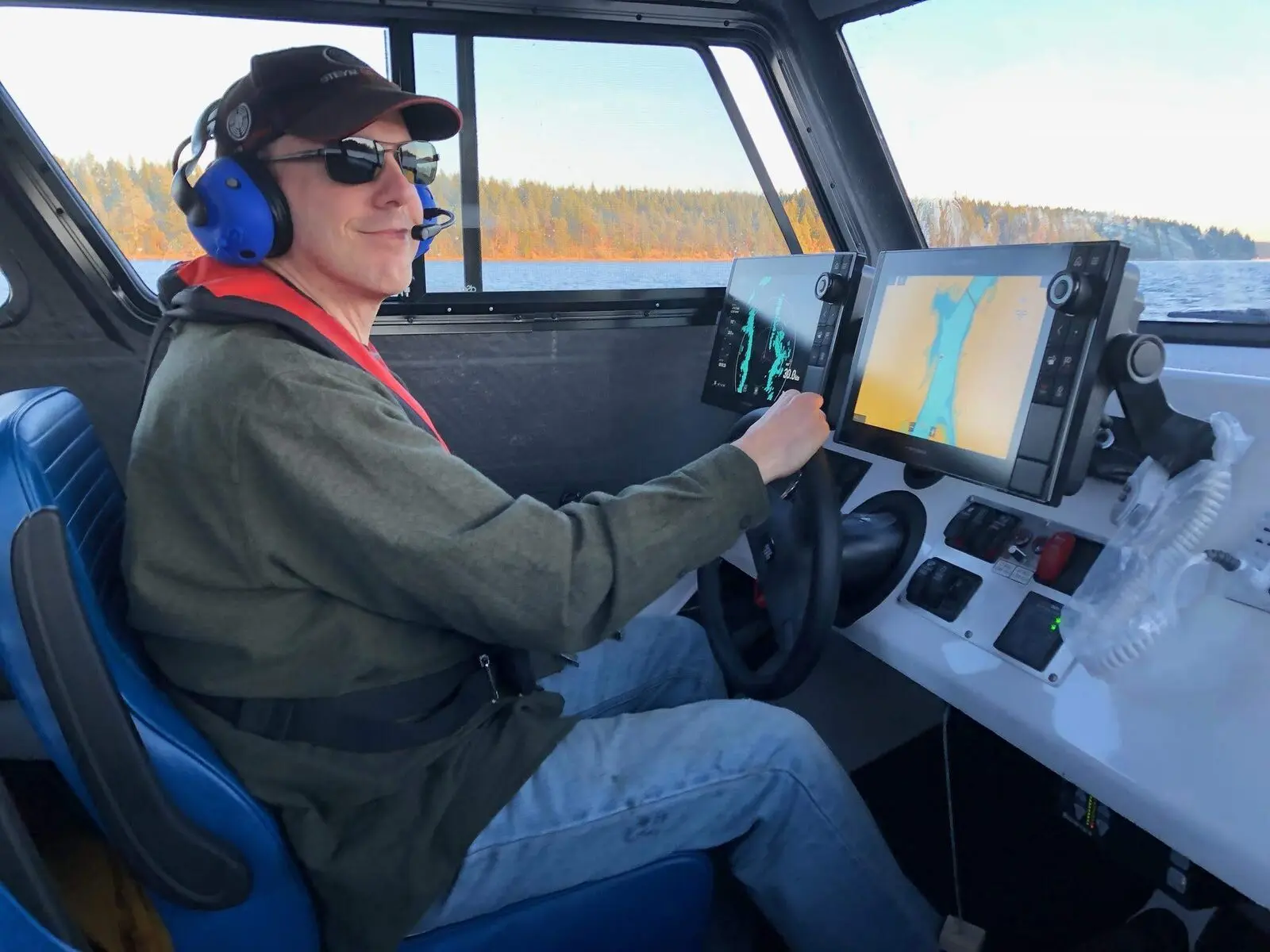 Bryan Phillips at the helm of an Explorer 24 on Puget Sound