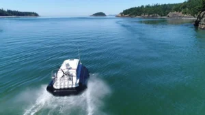 Aerial view of an Explorer 24 in turquoise water