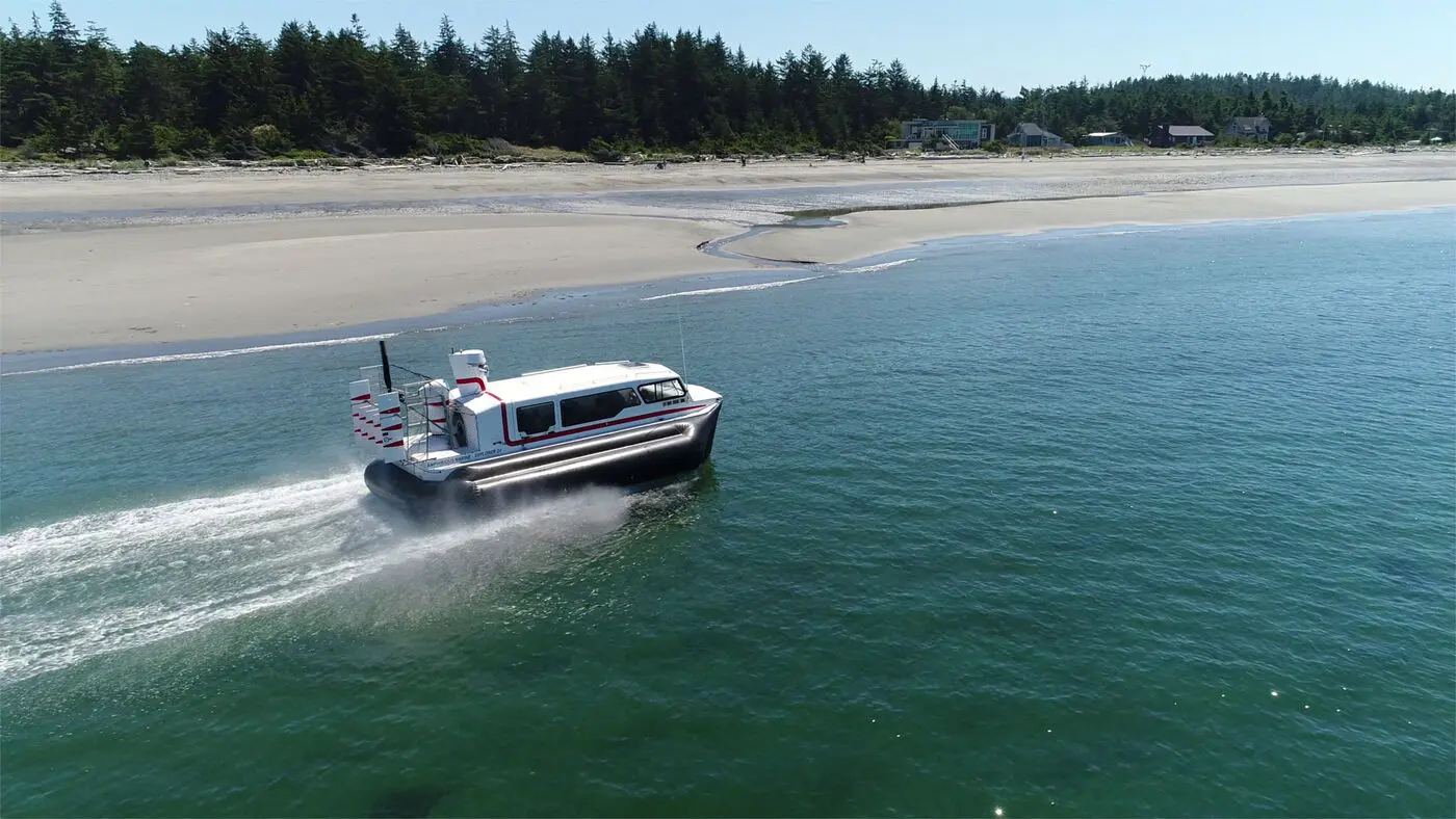Explorer 24 running along a sandy beach