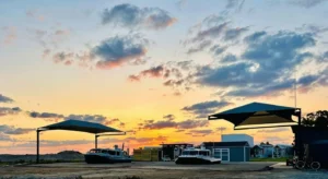 Two Explorer 24s under shade canopies at sunset