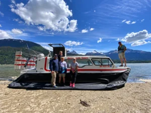 Tour passengers with an Explorer 24 hovercraft on an Alaska beach