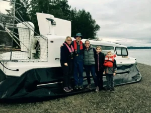 Friends standing in front of an Explorer 24 after a sea trial