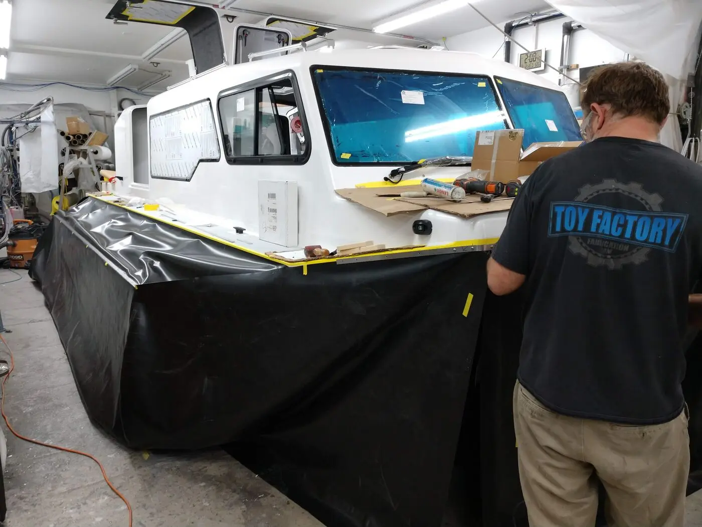 Builder working on an Explorer 24 in the shop