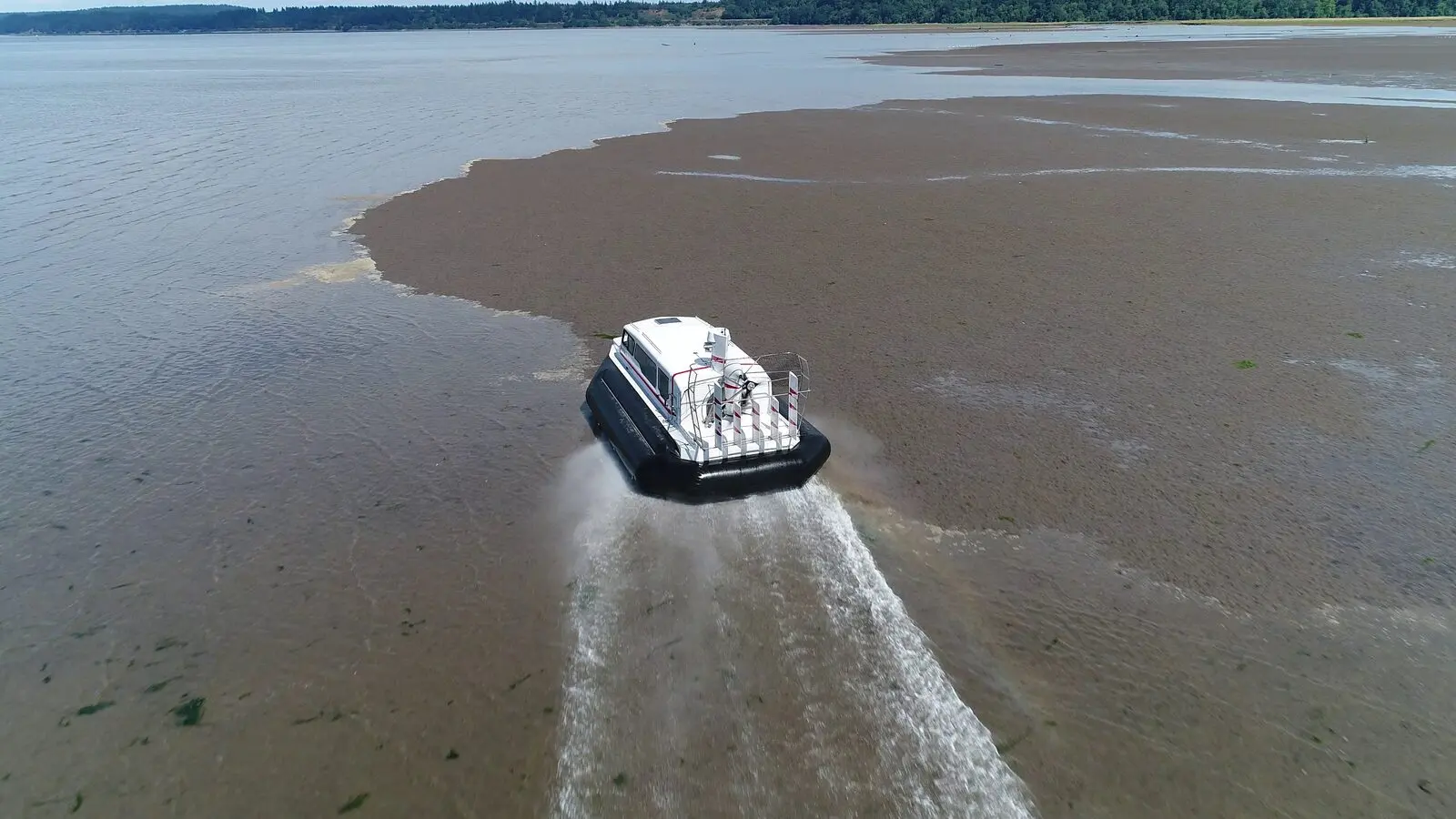 Explorer 24 hovercraft crossing tide flats at low water on Puget Sound