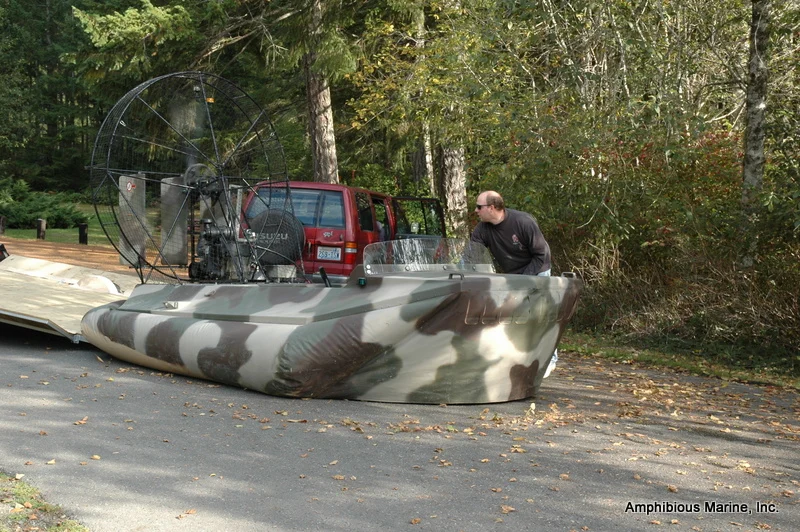 Hovercraft flying off the tilted trailer deck