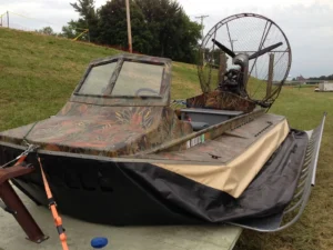 A Geoduck hovercraft with a camouflage finish parked on a trailer