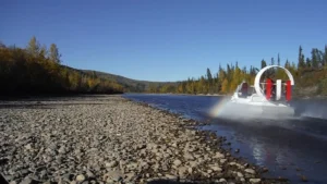 Matt's Geoduck running fast on the 40 Mile River past a gravel bar near Chicken, Alaska