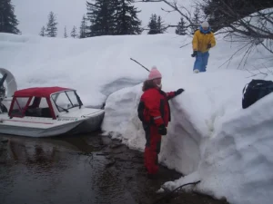 Small kit built hovercraft with a red top in deep snow