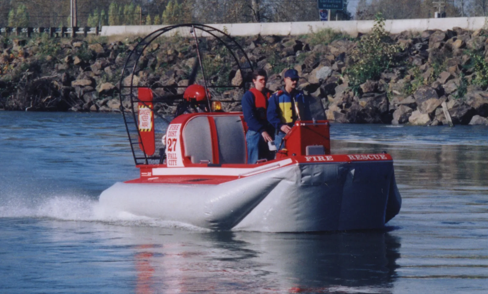 Fall City Fire District 27 Prospector rescue hovercraft running on a river with two crew aboard