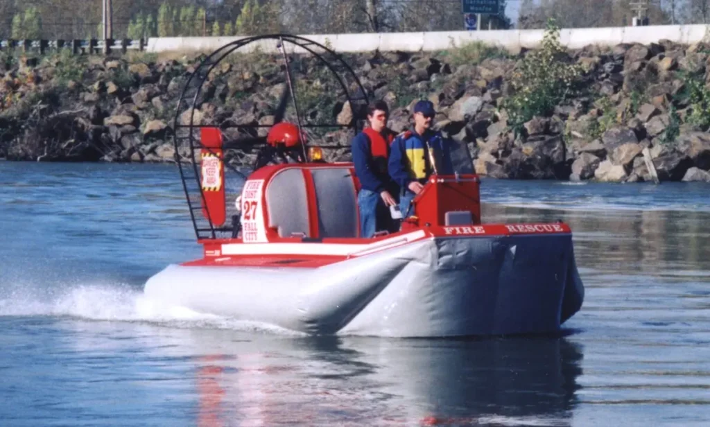 The Prospector SAR hovercraft on the water with its fire rescue crew aboard
