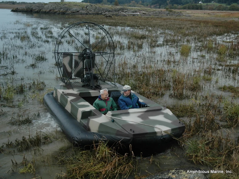 Duck hunters aboard the camouflaged Super Surveyor in a marsh