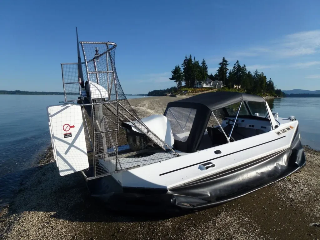Surveyor 16 with full enclosure parked on a beach