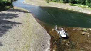 Surveyor 16 hovercraft crossing a river riffle at the tail of a gravel bar