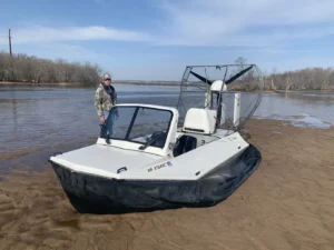 Surveyor 16 on a river sand bar with its pilot