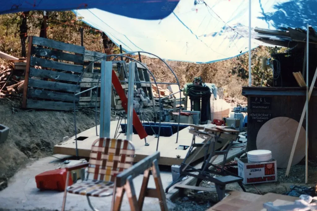 The UH-10T hovercraft under construction in a backyard workshop under a tarp, August 1987