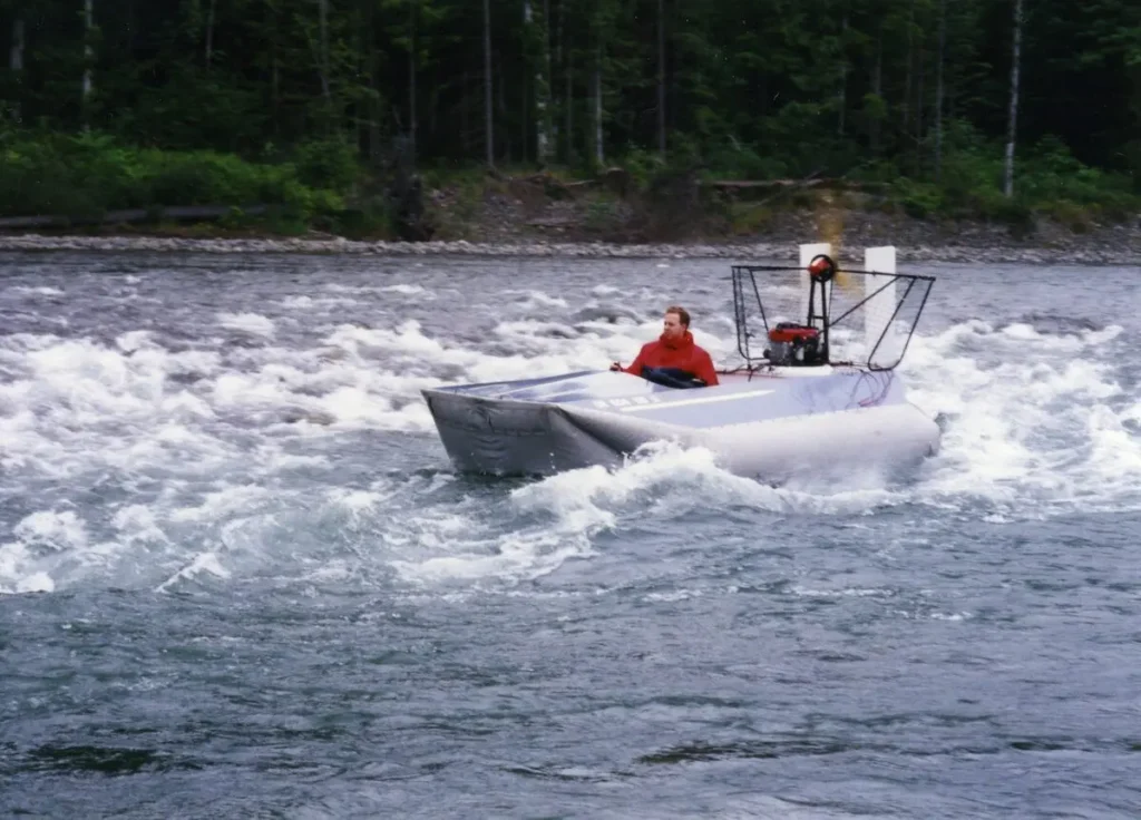 A Vanguard 14 hovercraft running through river rapids, 1993