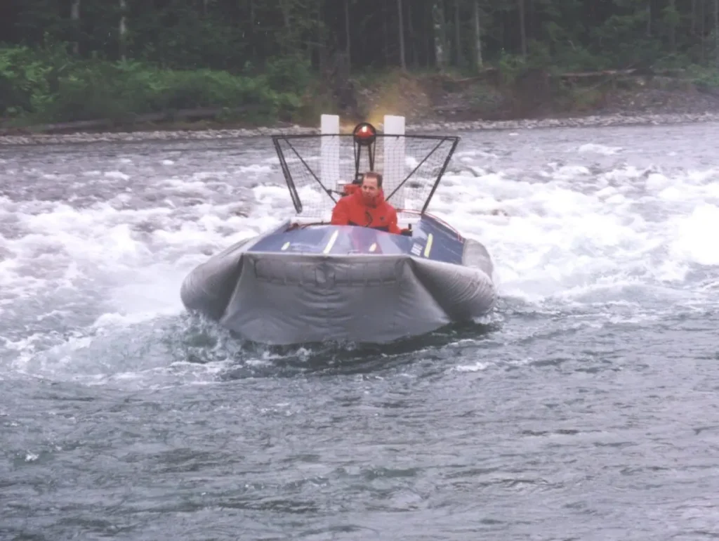 The first Vanguard 14 hovercraft running whitewater, seen from behind